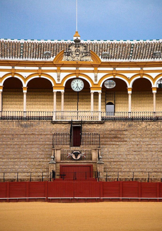 Gate of exit for the bullfighters of the Plaza de Toros in Seville with its typical colors of the Andalusian city.