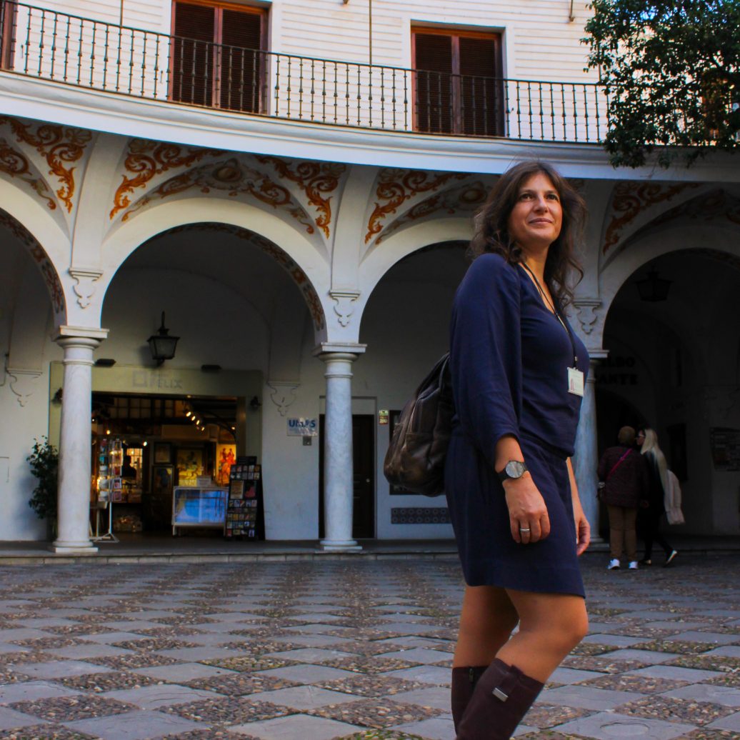 Alexia walking in one of the many special squares to enjoy in the tours of Andalucia.