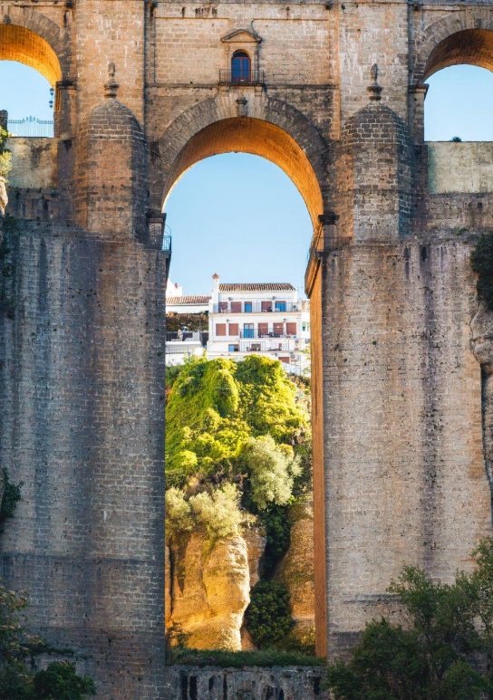 Detail of the main arch of the Ronda Bridge that connects the mountains to both sides of the village and we will cross in our experience.