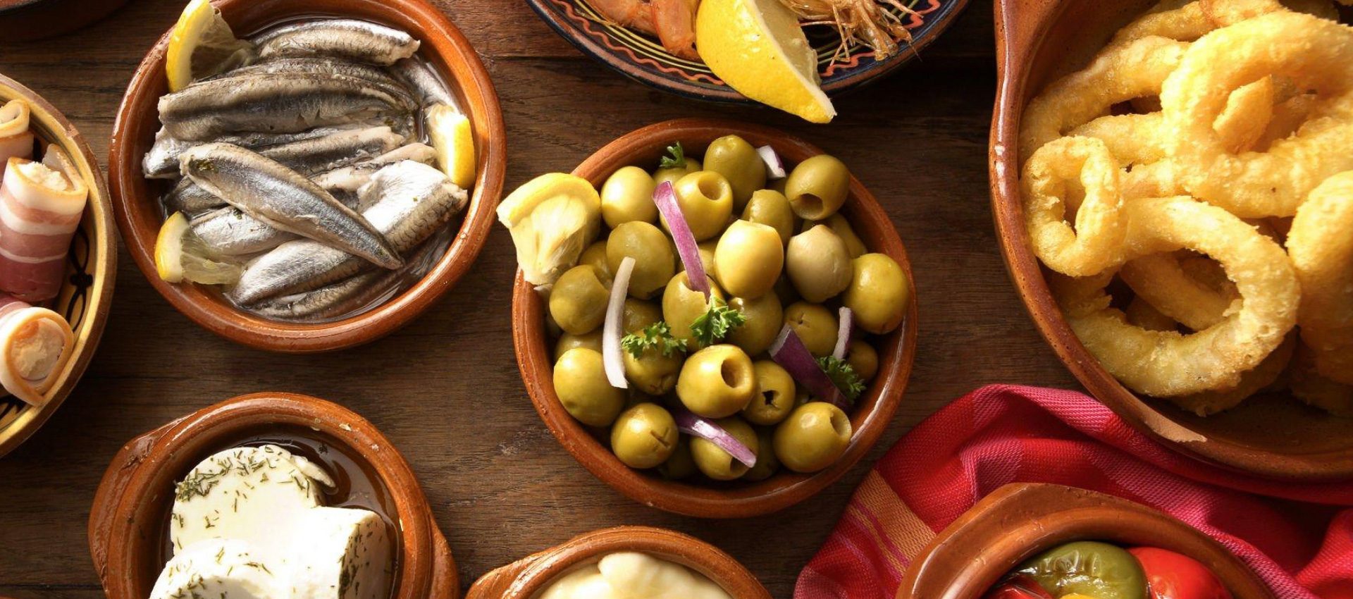 Different small dishes with typical and tasty tapas from our food experience.