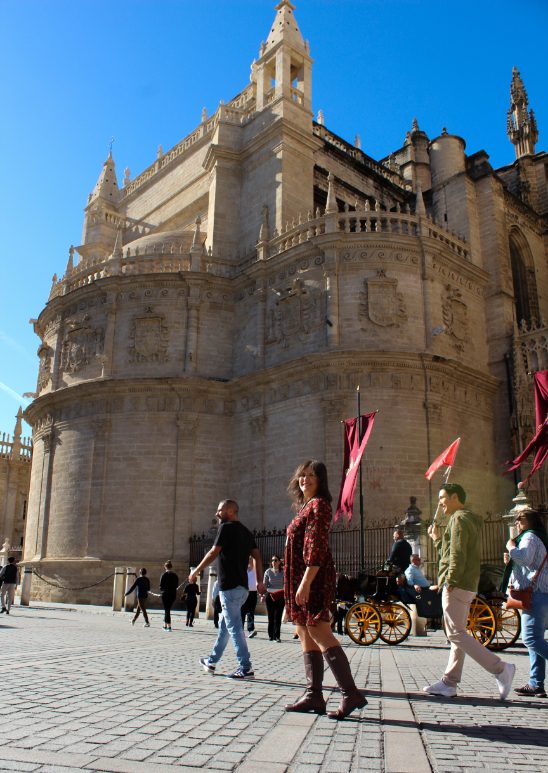 Alexia walking near the cathedral in Seville during the warm November temperatures.